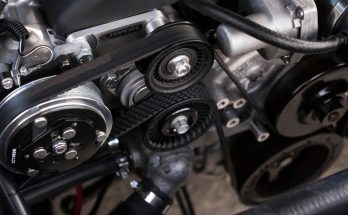 Mechanic working on a vehicle transmission