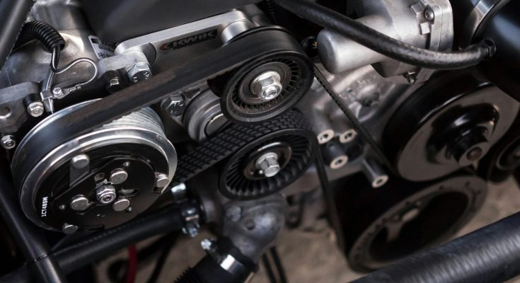 Mechanic working on a vehicle transmission