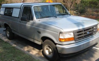 Gray 1992–1996 Ford F-150 pickup parked beside a road