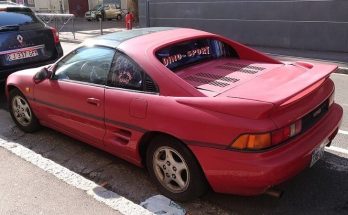 Red 1991 Toyota MR2 G-Limited parked on a city street