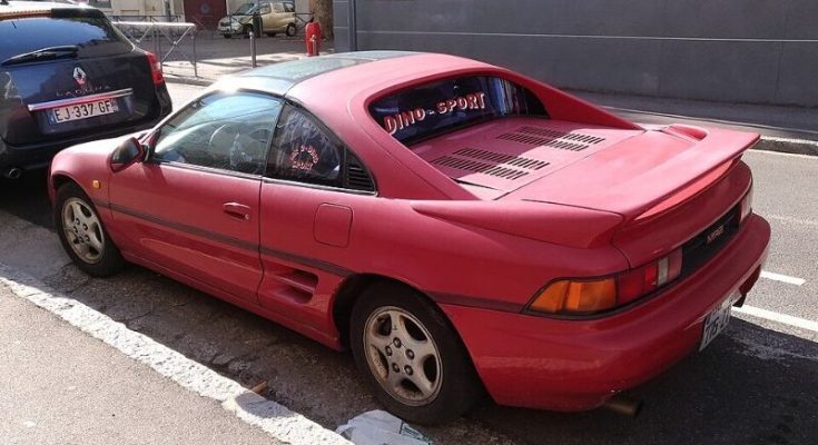 Red 1991 Toyota MR2 G-Limited parked on a city street