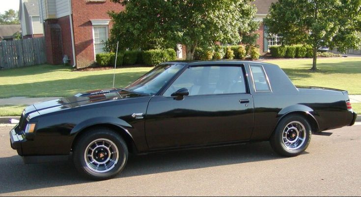 Black 1987 Buick Grand National parked in a residential neighborhood